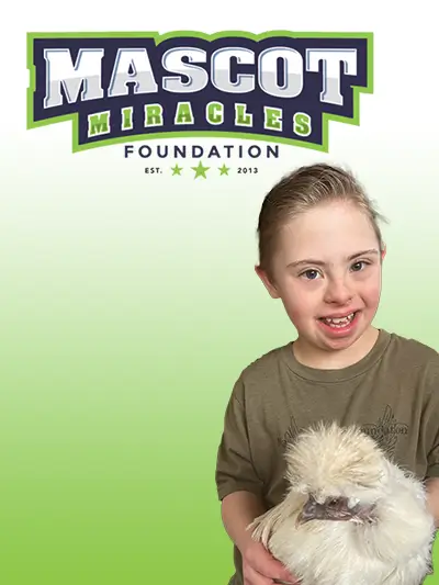 Mascot Miracles Finn holding a chicken